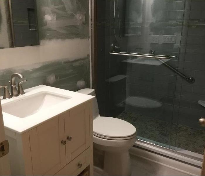 This bathroom needed remolding after water damage services