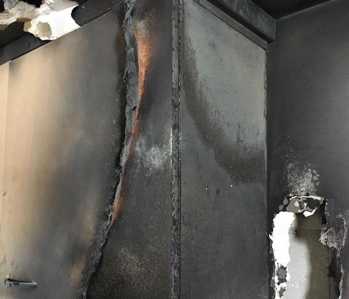 fire damage to a kitchen cabinet 